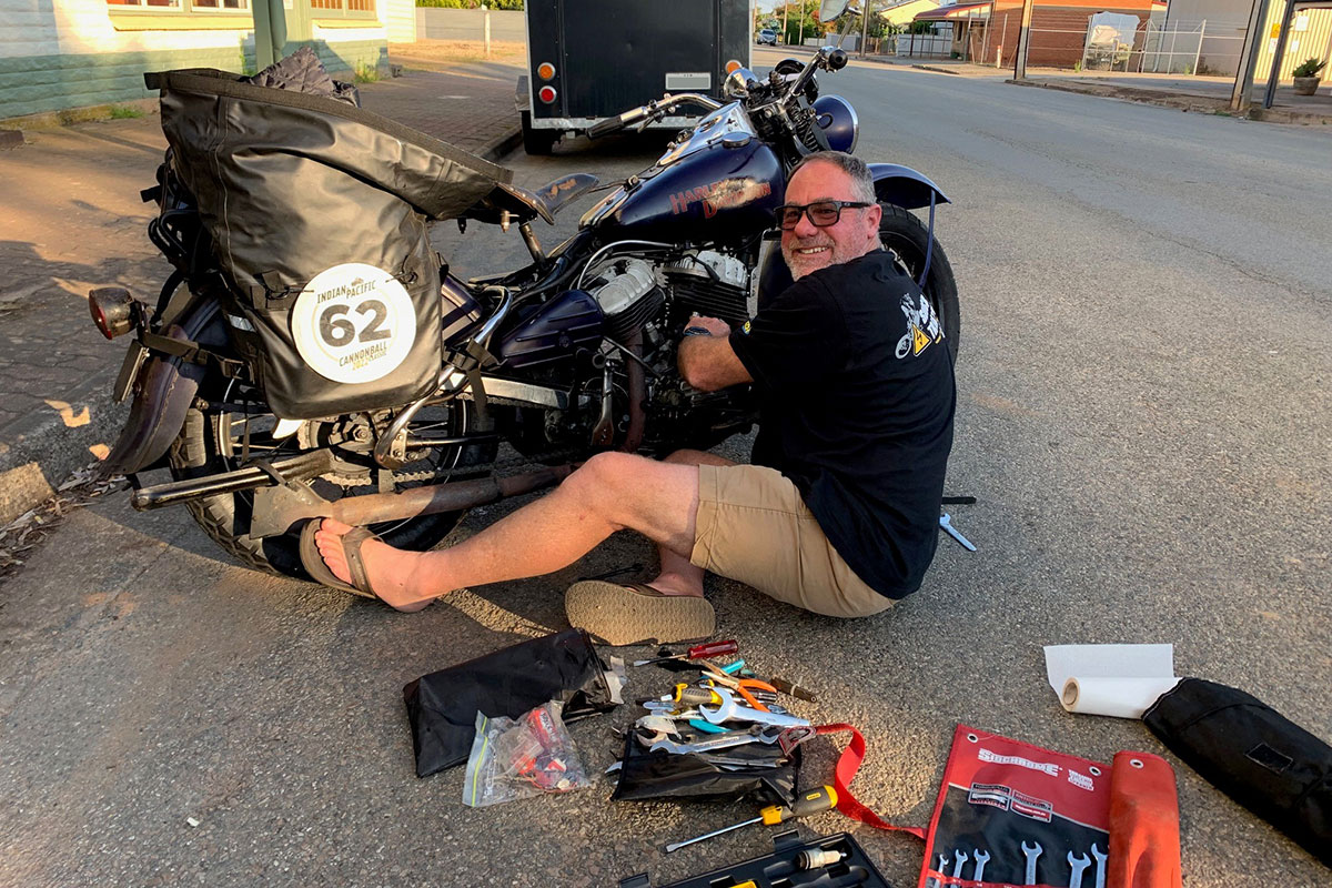 Derek maintaining his motorcycle